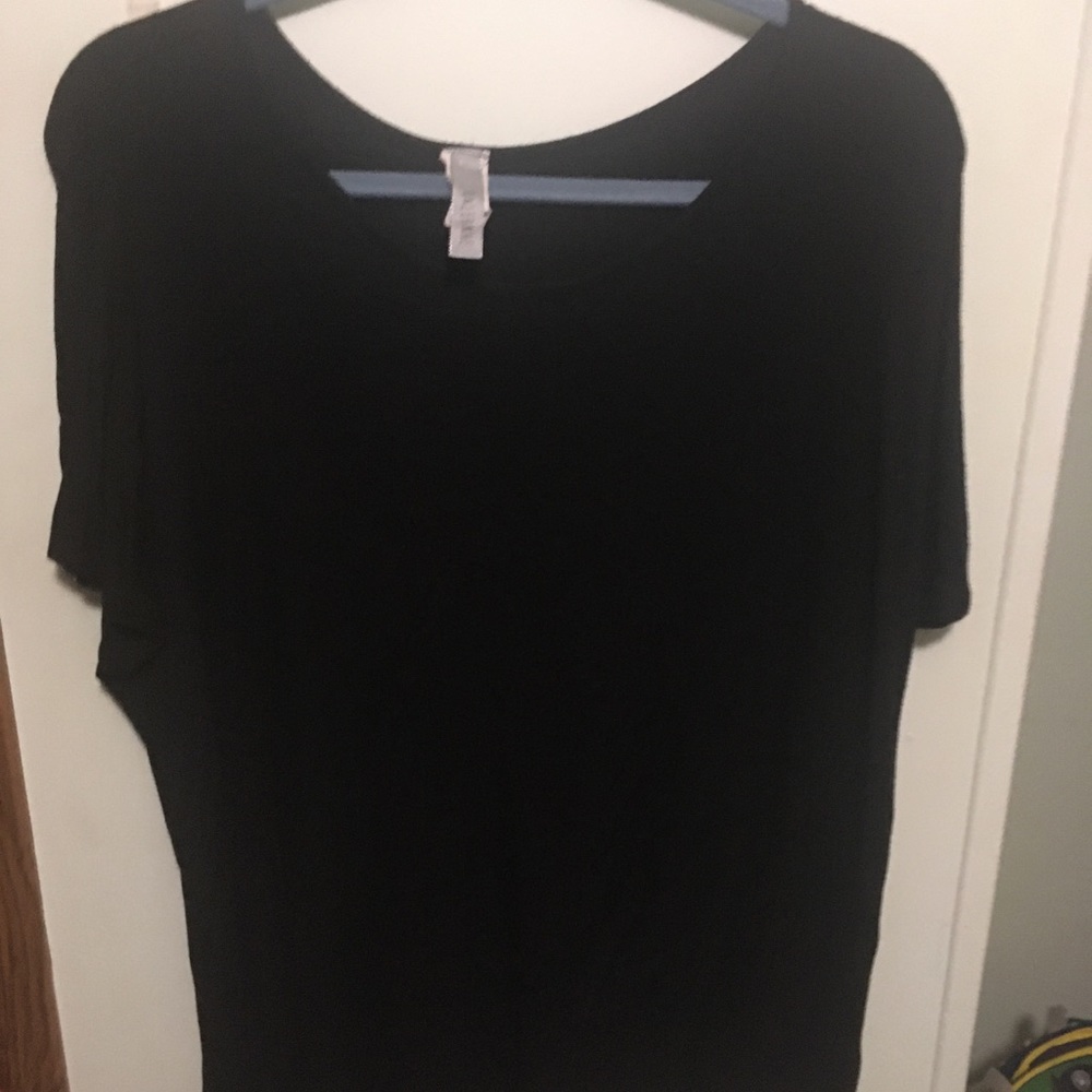 Super cute black top with unique back